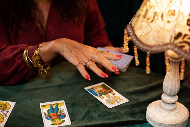 woman-with-tarot-cards-front-view_23-2150006224